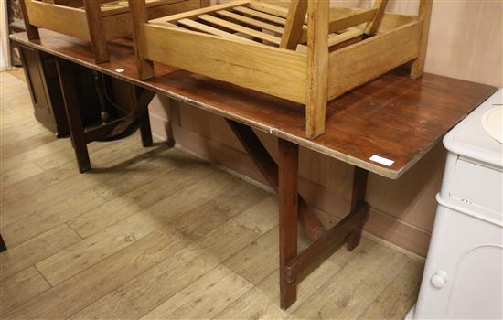 Stained pine trestle table W.228cm